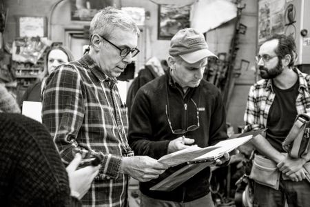 Aaron Weisblatt and DP Robert Featherstone consult the script