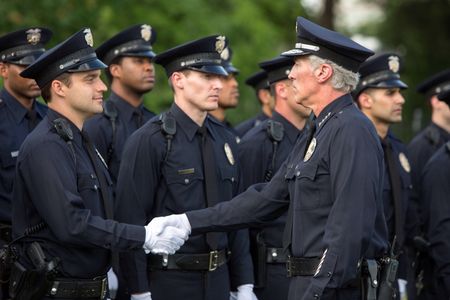 Actor/Model Fred Galle LA Police Chief Cantor shakes hands with Officer Actor Jake Johnson in Let's Be Cops 2014