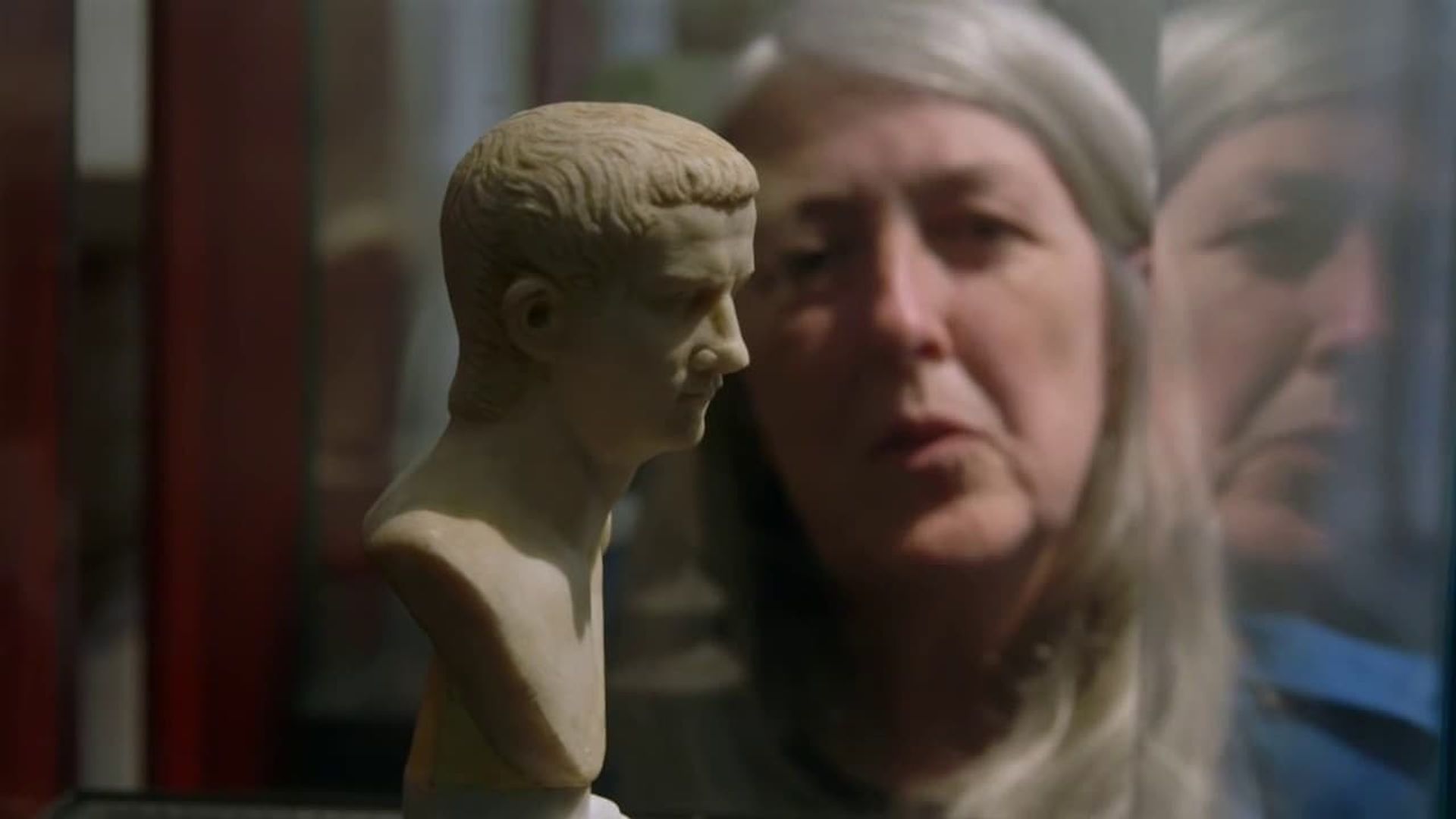 Caligula with Mary Beard background