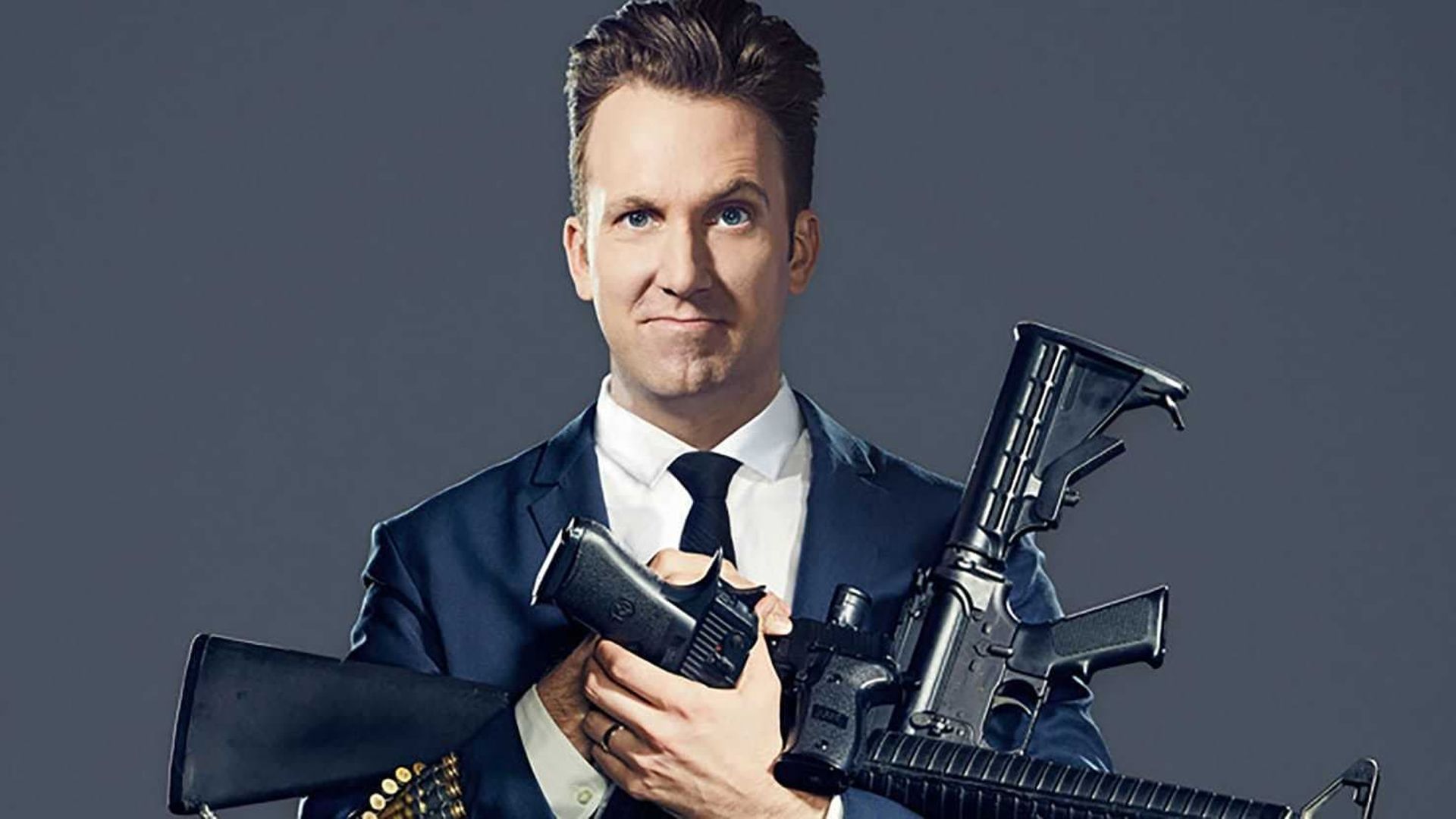 Jordan Klepper Solves Guns background