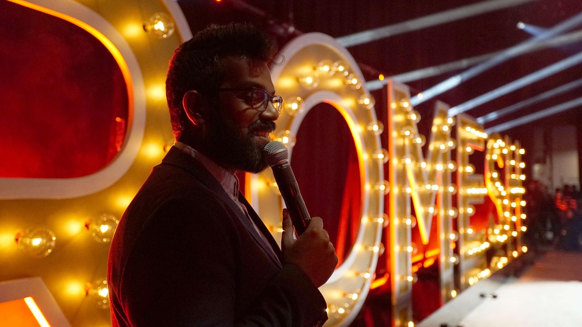 Romesh Ranganathan: Just Another Immigrant - Romesh at the Greek background